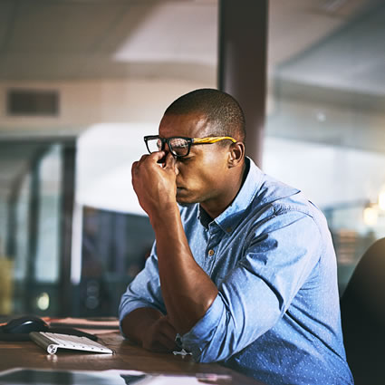 man stressed with headache