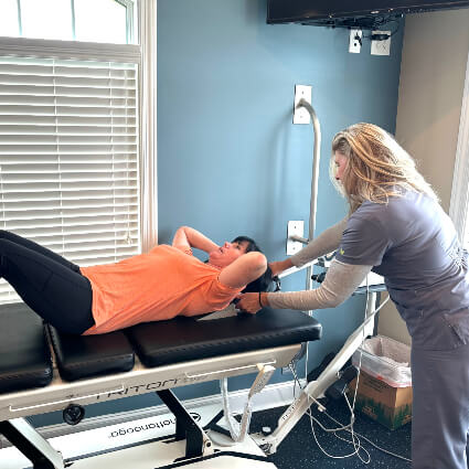 Woman receiving traction therapy