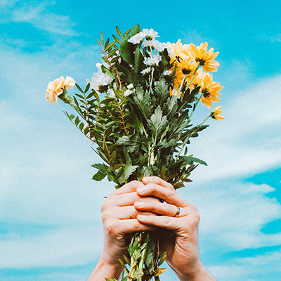 person holding a bouquet of flowers