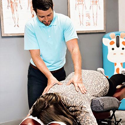 Blue Wing Chiropractic, LLC patient getting back adjusted