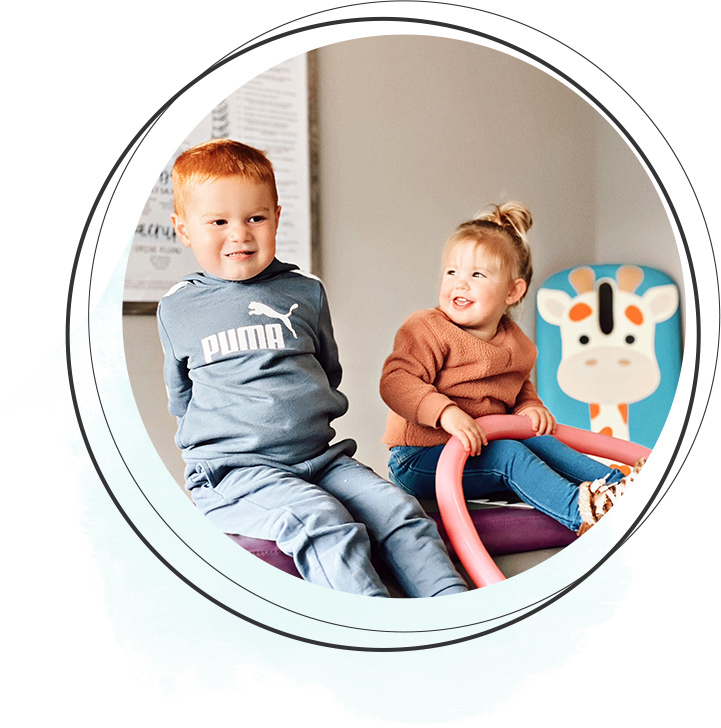 kids sitting on adjusting table