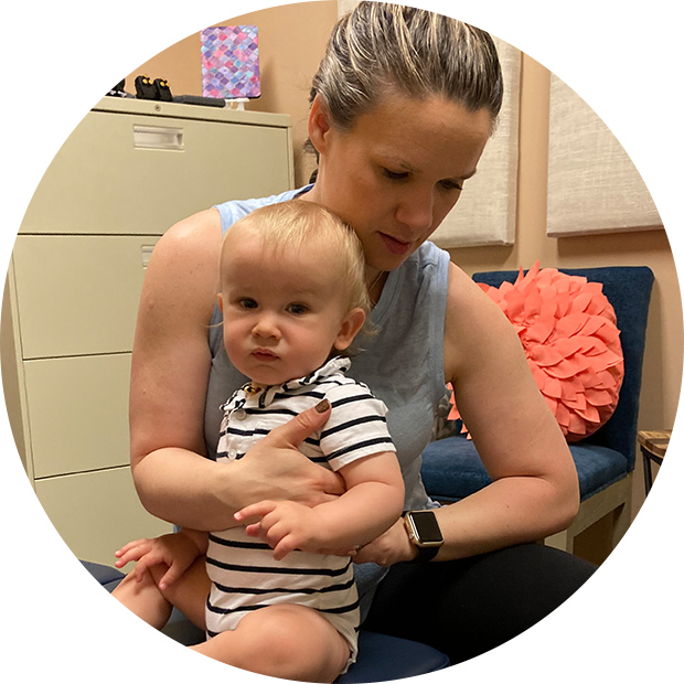 chiropractor adjusting baby