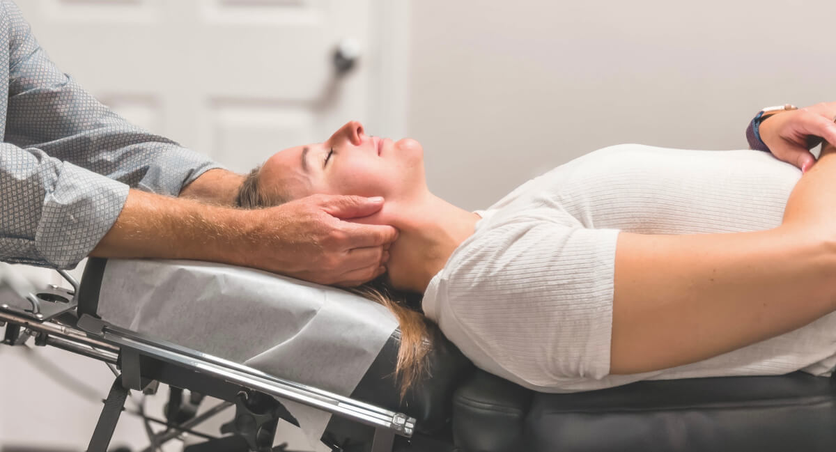 Spring Lake patient receiving a chiropractic neck adjustment