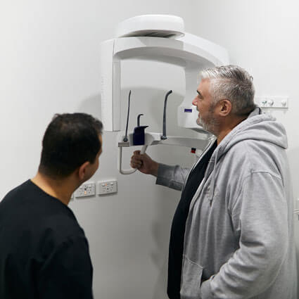 Dr Mina taking male patient xray