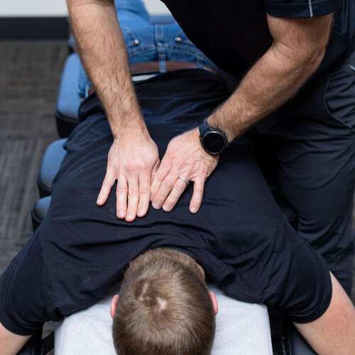 Upper-back adjustment for male patient