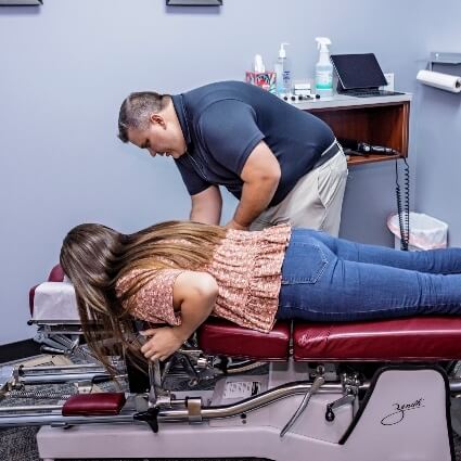 Gahanna chiropractor Dr Lorenz adjusting patient