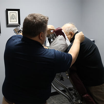 patient laying into an adjusting table