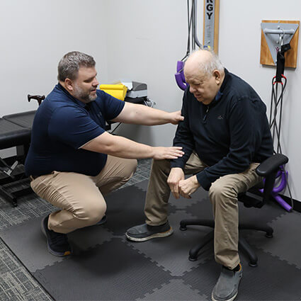 Dr Nathan touching patients arm