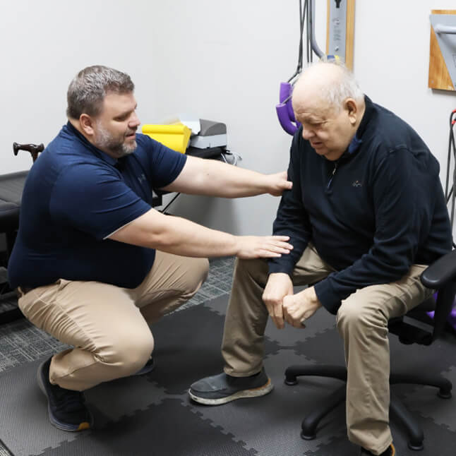 Gahanna chiropractor Dr Nathan touching patients arm