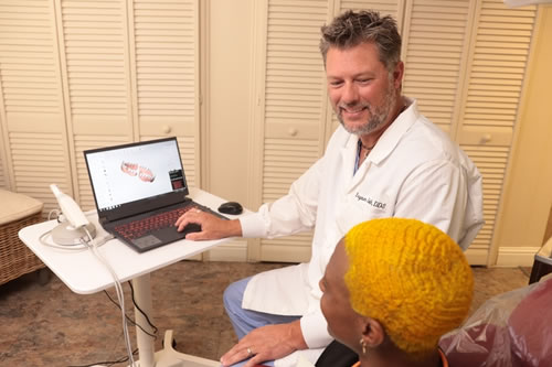 Dr. Bryan showing dental image