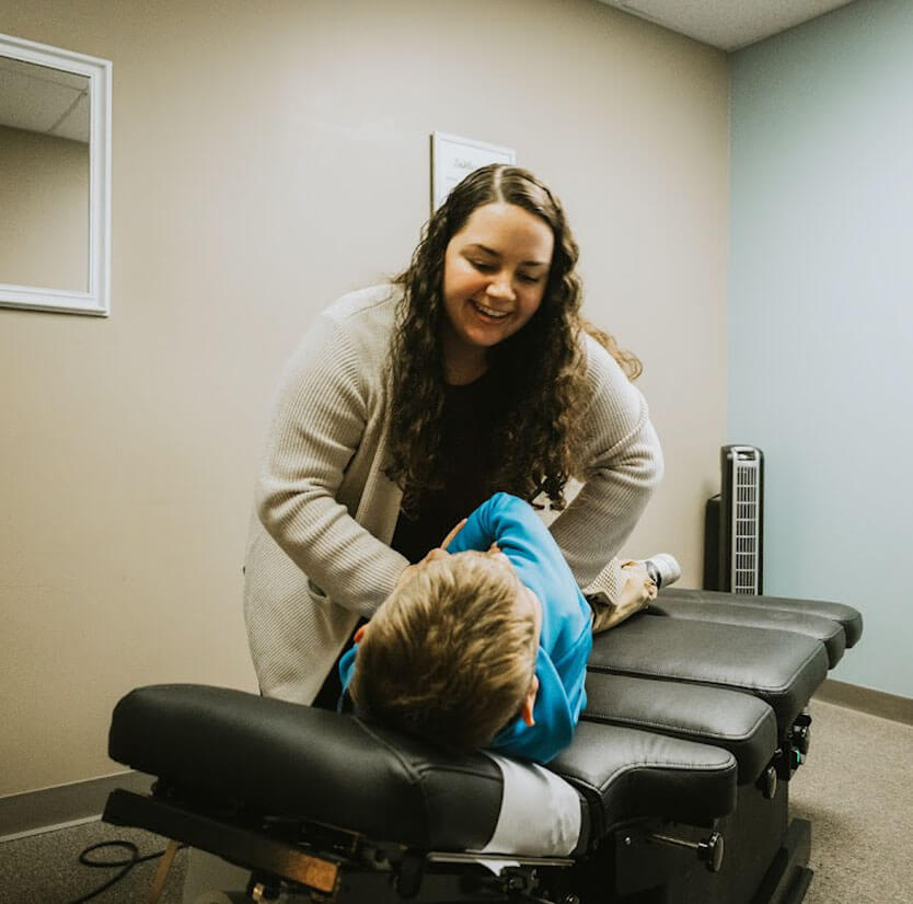 Doctor adjusting child