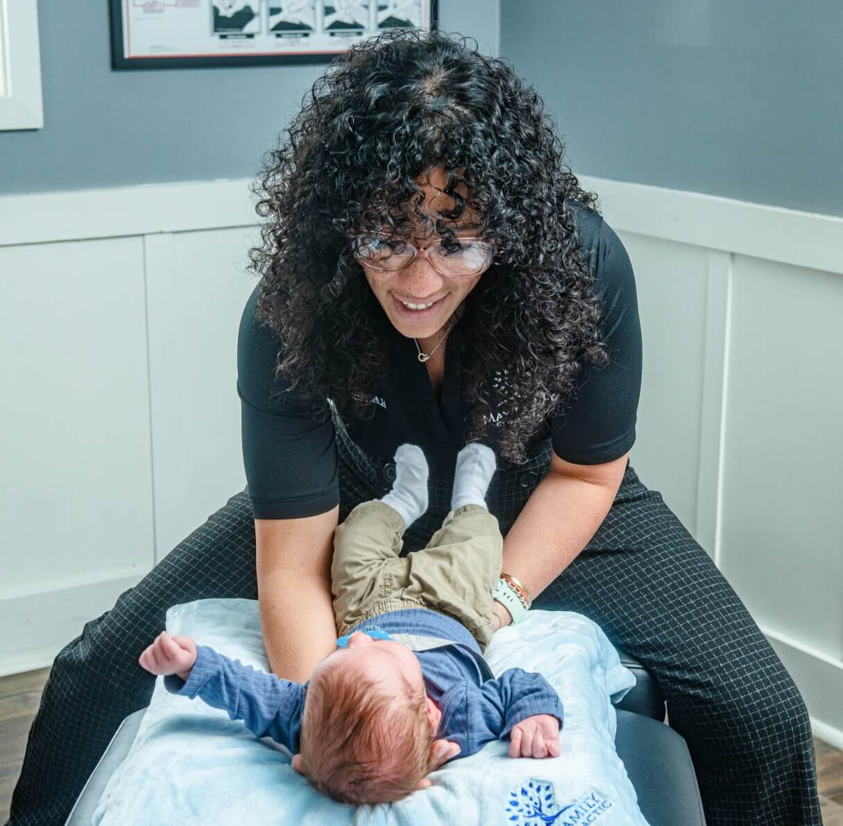 Morristown chiropracto adjusting baby
