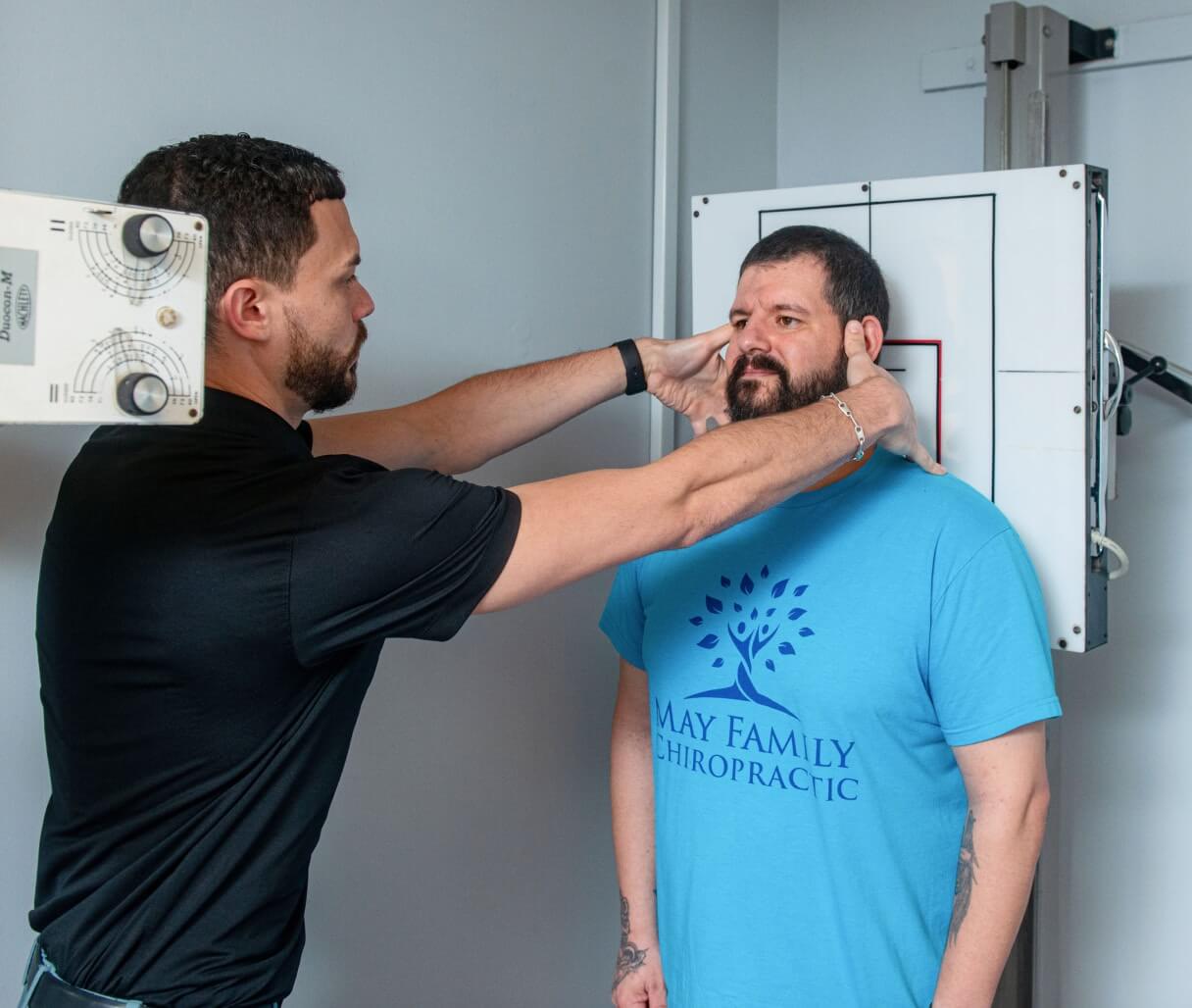 Morristown chiropractor inspecting patient