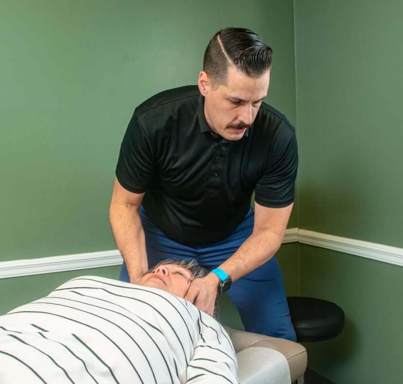Morristown patient receiving a chiropractic adjustment at May Family Chiropractic