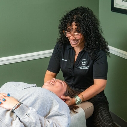 Dr Alicia adjusting patients neck