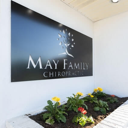 May Family Chiropractic sign on building