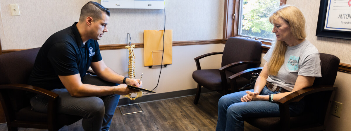Morristown chiropractor in a consultation with a woman