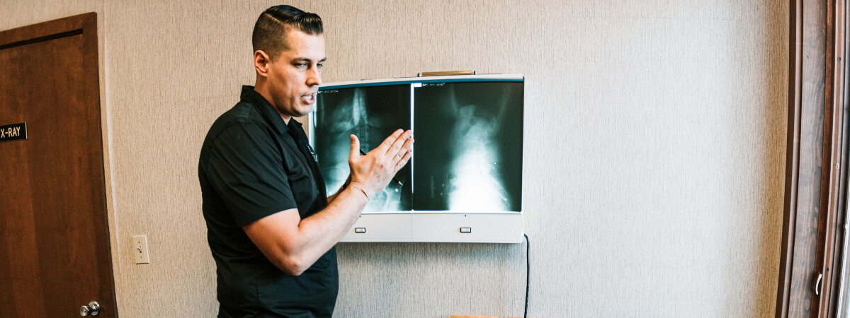 Morristown chiropractor discussing x-rays with patient