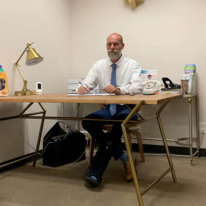 Dr. David at desk