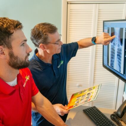 doctor pointing at xrays