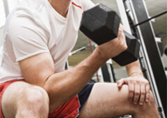 man lifting weights