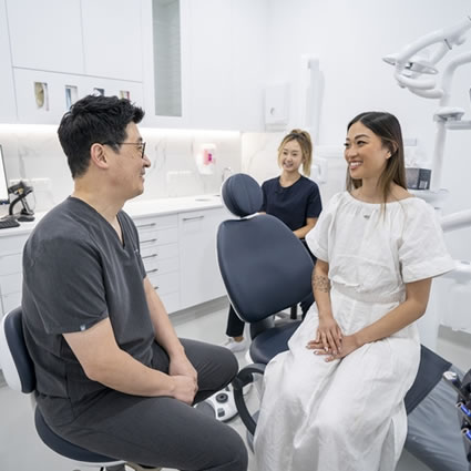 Dr Park with female client smiling