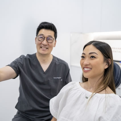 Dr Park with female client explaining procedure