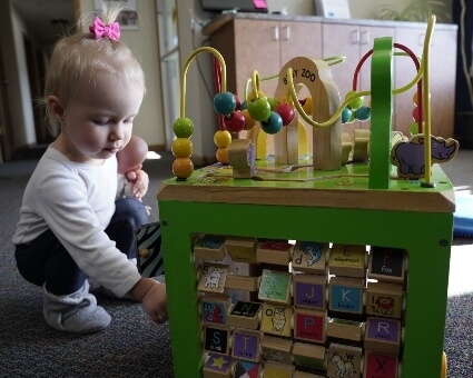 Pediatric Chiropractic Little girl in practice play area
