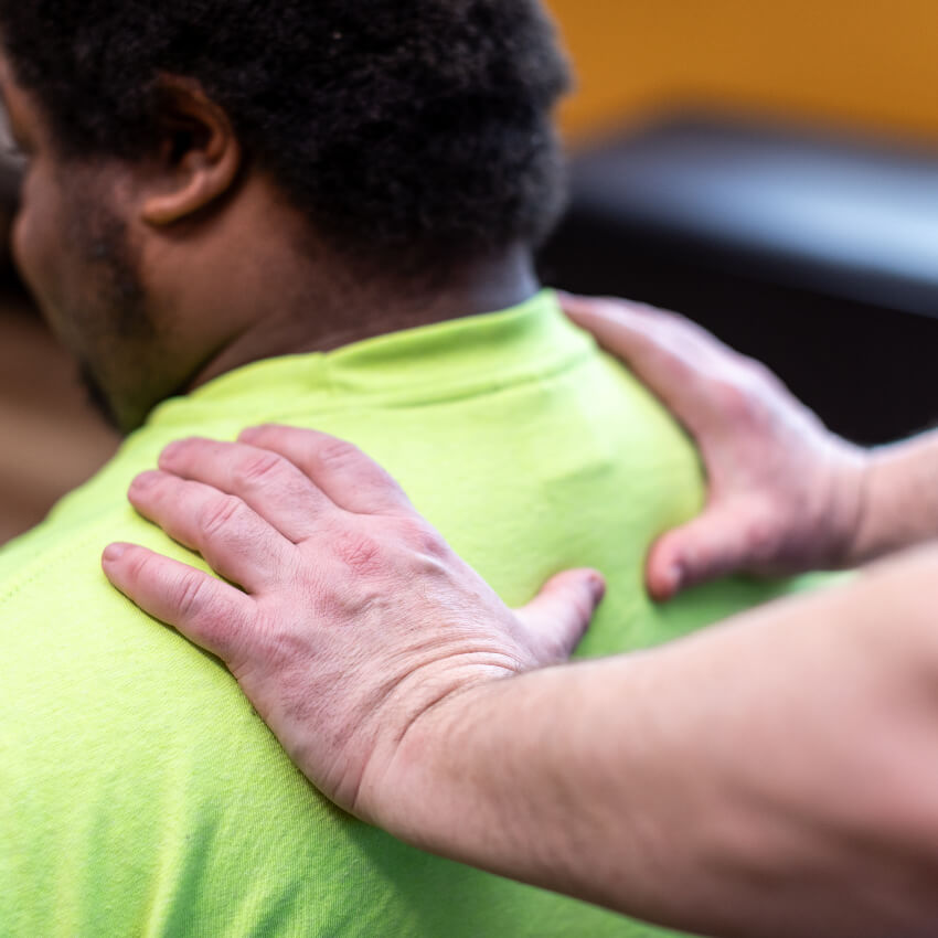 patient having shoulders massaged