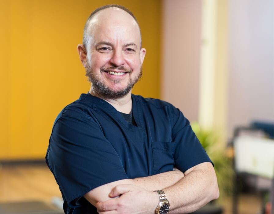 Dr. Andosca standing outside practice