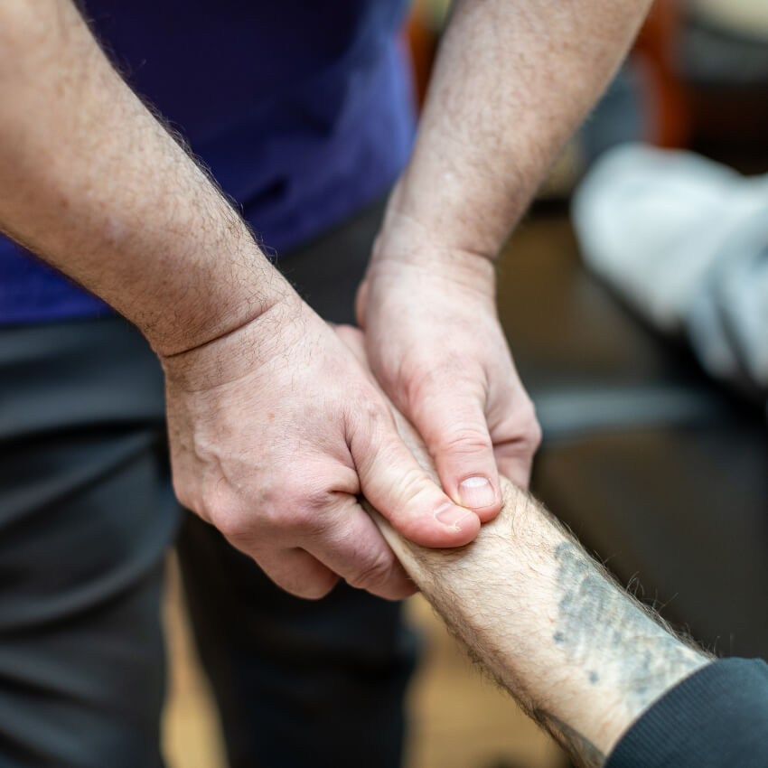 120 Chiropractic Inc. patient having their wrist adjusted