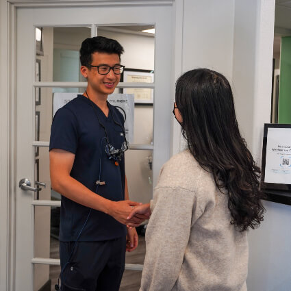 shaking hands with patient