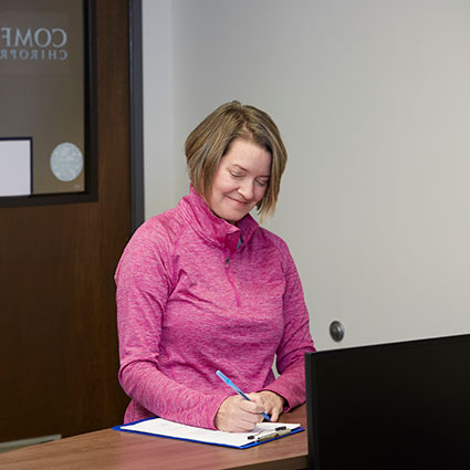 Woman filling out paperwork