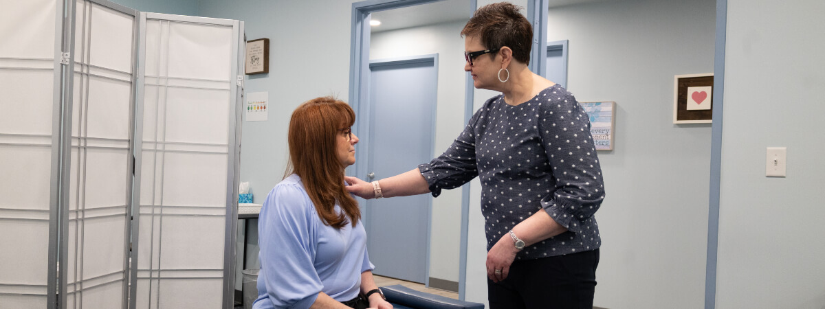 Dr Julie talking with patient