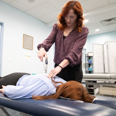 Fishers chiropractor adjusting a patient using Activator method