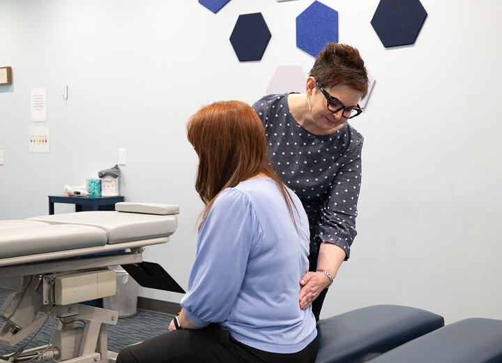 Chiropractor checking patient