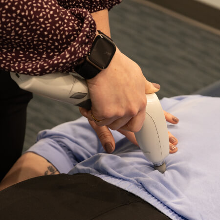 Fishers chiropractor treating a patient using Activator Method