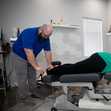 Dr. Rob checking patients feet