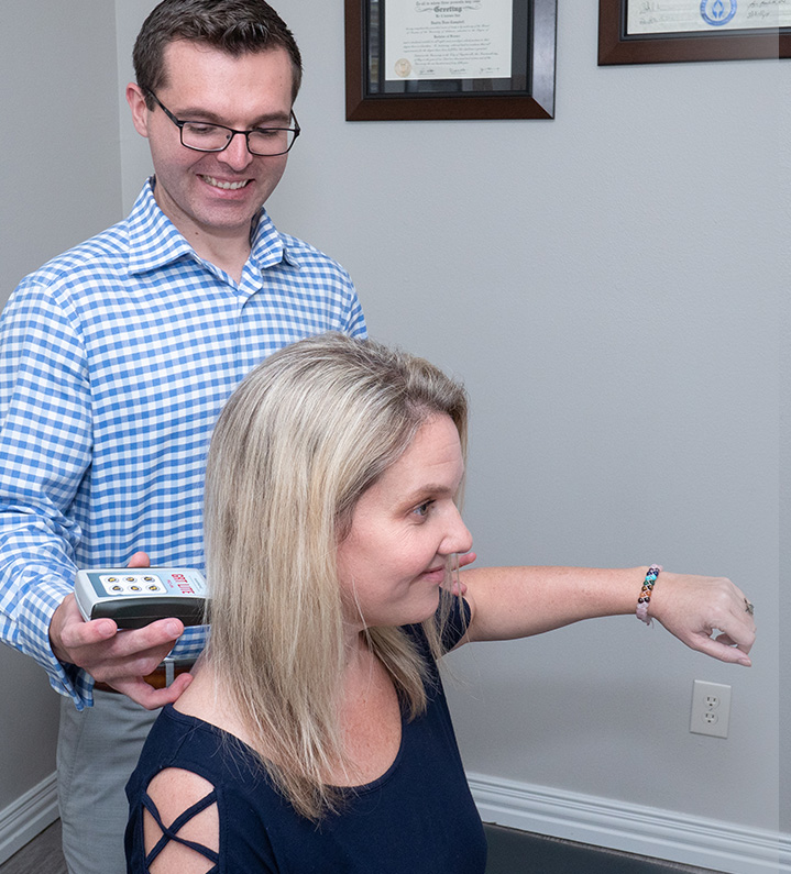 Dr. Campbell scanning woman's neck