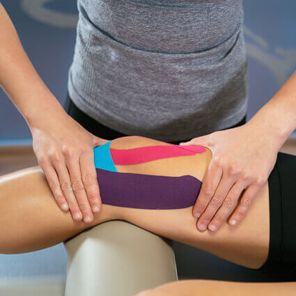 tri-colored-kinesiotape-on-knee-sq