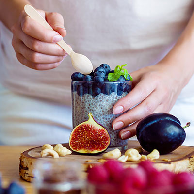 woman preparing a healthy chia bowl