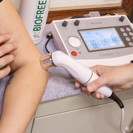 ultrasound therapy on persons arm