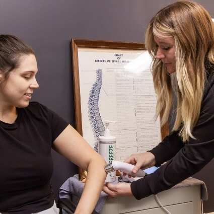 ultrasound therapy on persons arm
