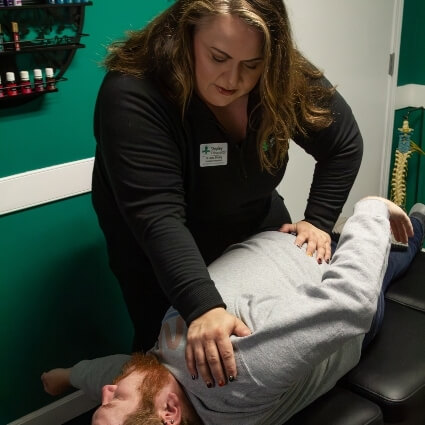 Dr Shipley working on patients shoulder