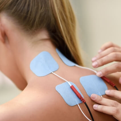e-stim pads on womans neck