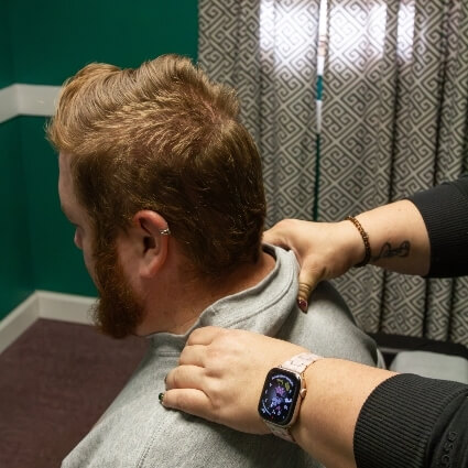 Dr Shipley adjusting patients neck