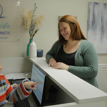 Woman at reception desk