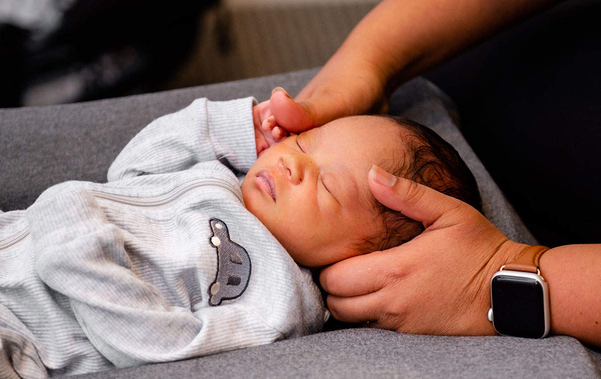 Tiny baby getting adjustment