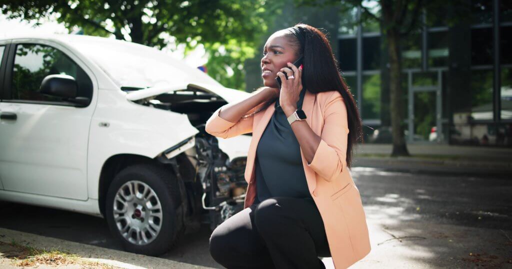 Woman Talking To Reliable Car Mechanic