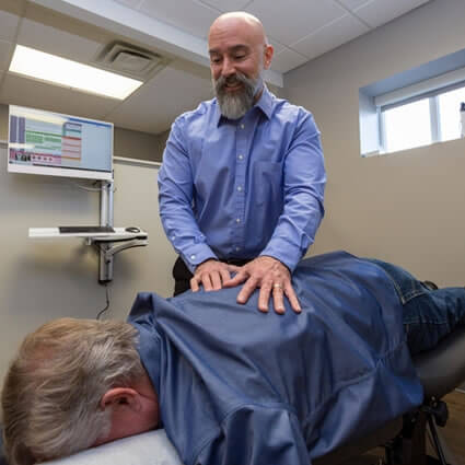 Dr. Prinkey adjusting patient